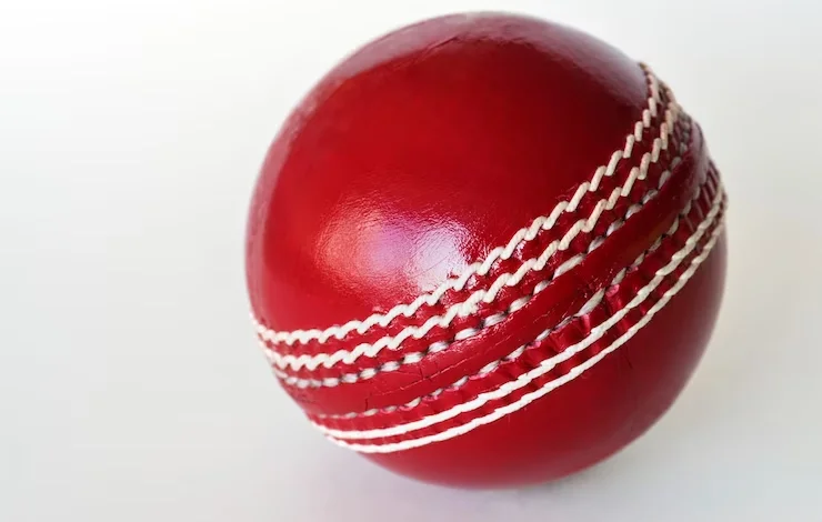 a red ball with white stitching